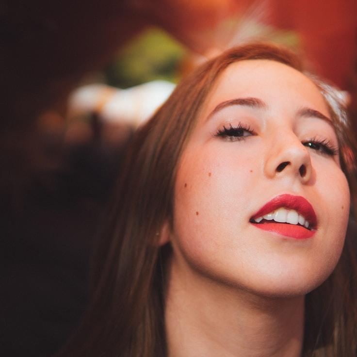 Kaveri Mehta, Lead Design Curator at ForestCabinMoss, reviewing corporate floral arrangements